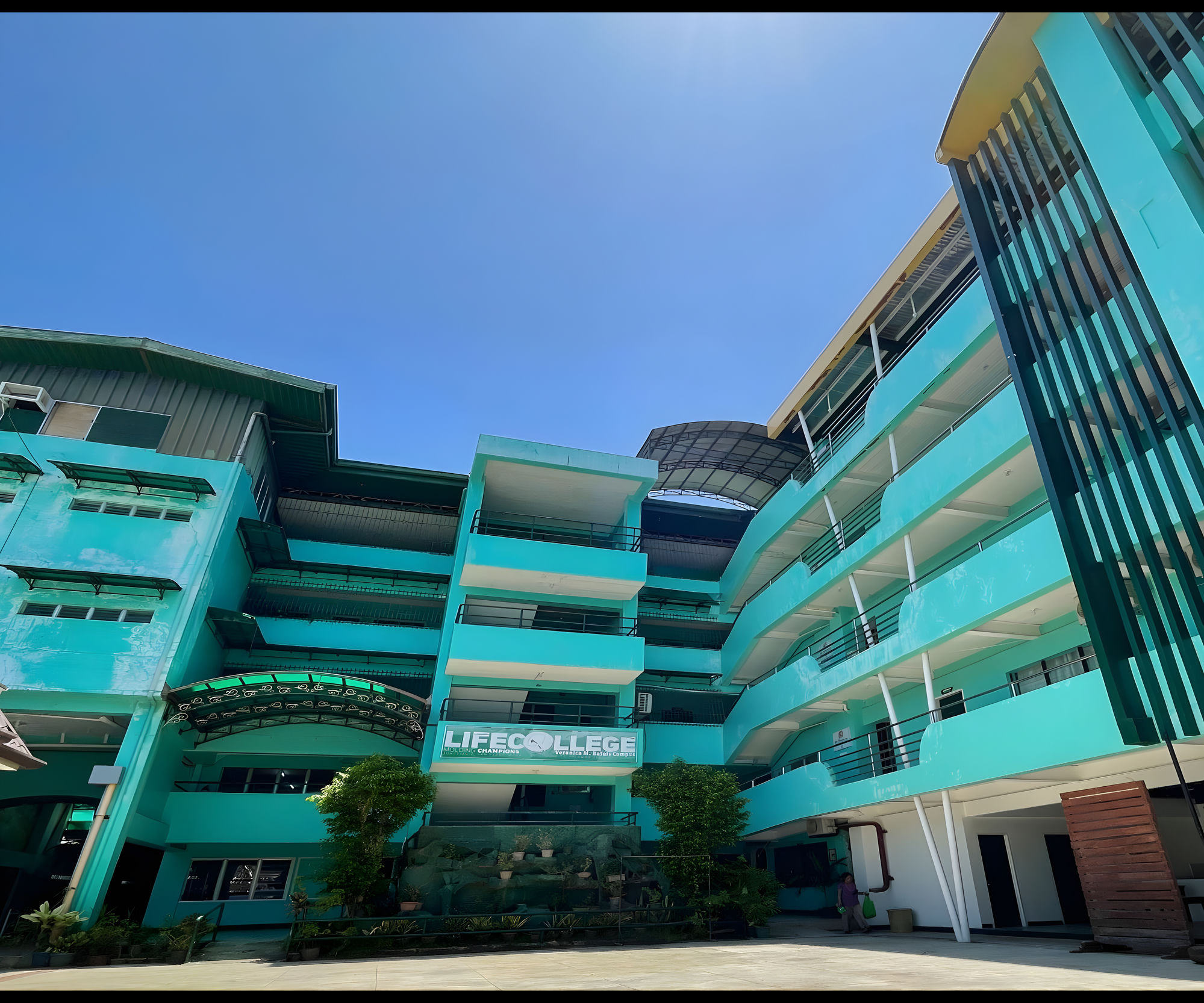 LifeCollege modern turquoise campus building